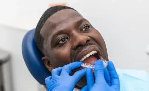 close-up-of-dental-hygienist-fitting-a-retainer-on-2024-10-07-21-33-34-utc